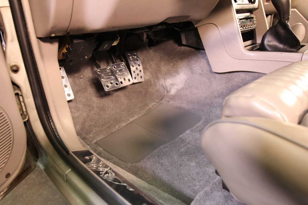 pedals & front footwell of a ford foxbody mustang