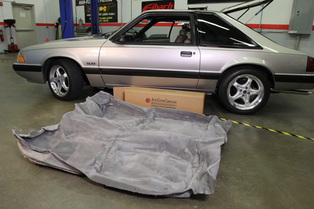 new carpet alongside a foxbody ford mustang