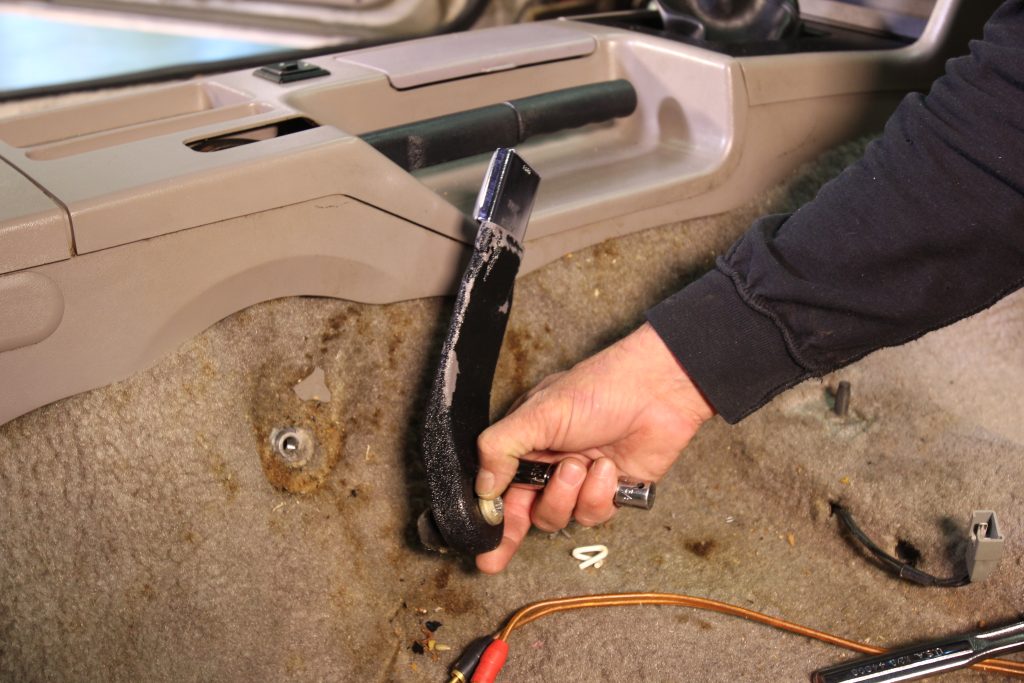 removing seat belt bracket from an old Fox Mustang