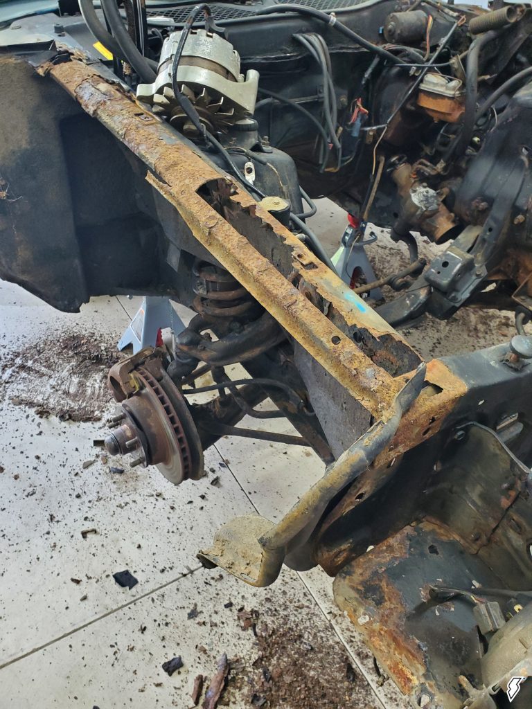 rusty fender support and sheetmetal on a 1973 Ford Mustang Grande