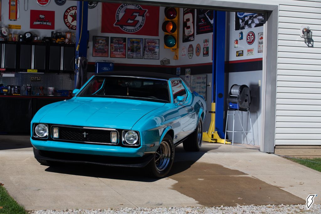 1973 Ford Mustang Grande rolling out of garage