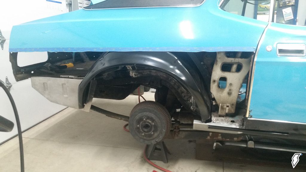 rear quarter sheetmetal cut and removed from a classic car