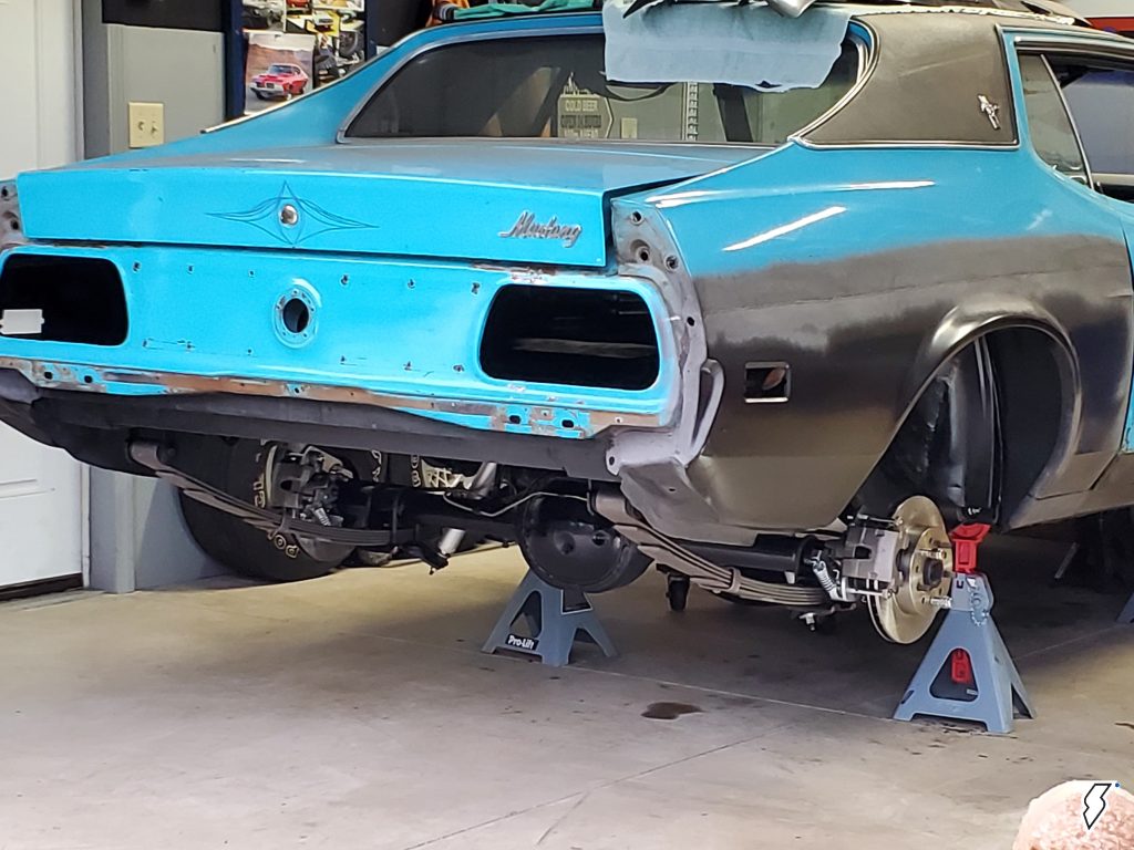 rear view of a classic car undergoing bodywork