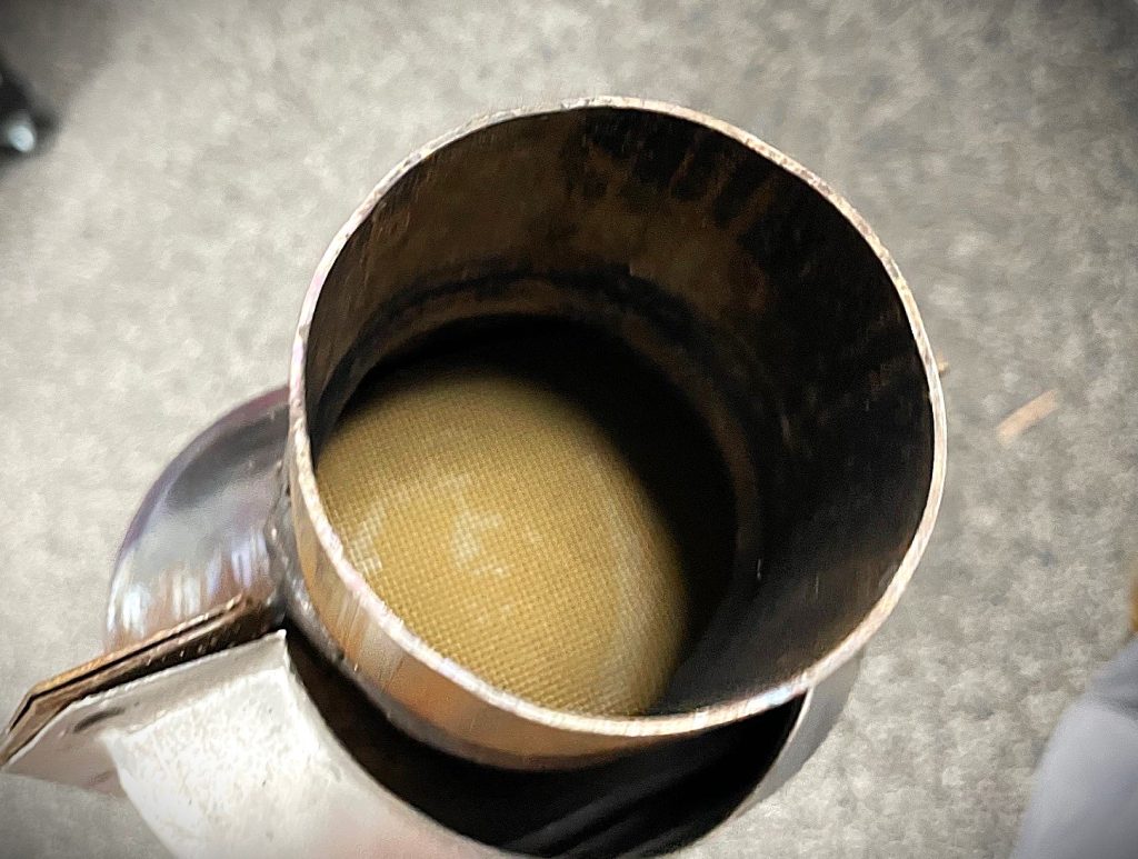 looking inside mesh grid inside a catalytic converter